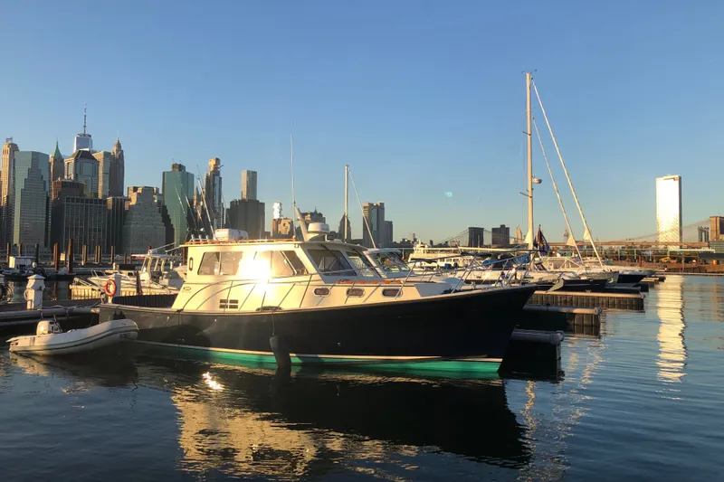 Slide: The Image of 2018 Eastern 35 Casco Bay boat docked in urban marina at sunset. - 2