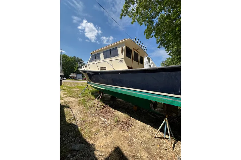 Slide: The Image of 2018 Eastern 35 Casco Bay boat on stands, sunny day, outdoor setting. - 39