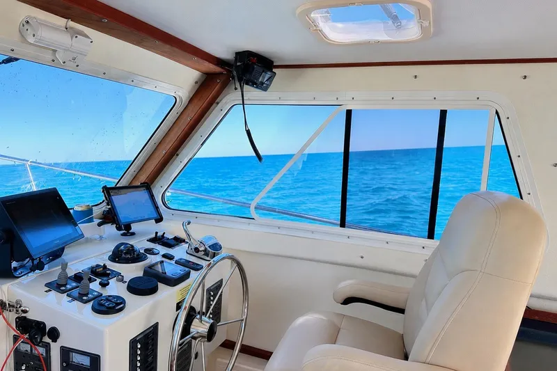 Slide: The Image of Interior view of 2018 Eastern 35 Casco Bay boat cockpit with ocean view. - 14