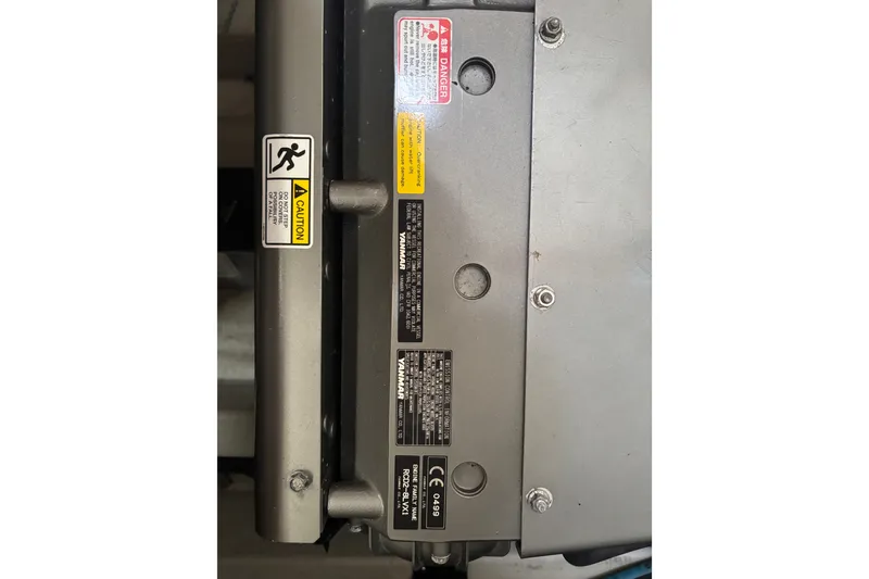 Slide: The Image of Engine compartment of a 2018 Eastern 35 Casco Bay boat with caution labels. - 30