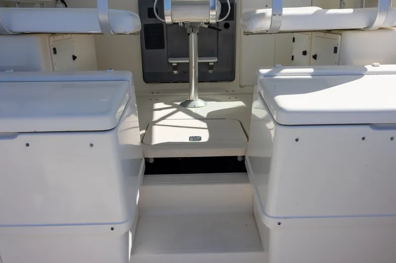 Slide: The Image of 1997 Tiara Yachts 3500 Express interior with seating and storage compartments. - 12