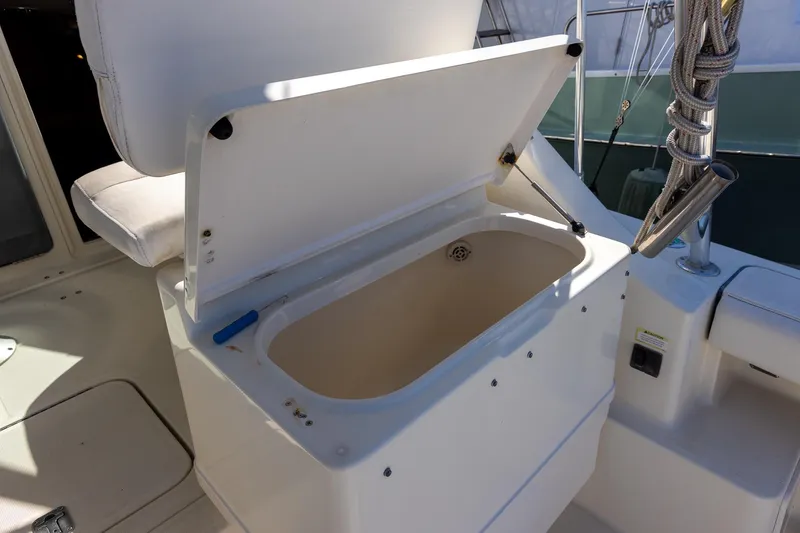 Slide: The Image of Open storage compartment on 1997 Tiara Yachts 3500 Express boat deck. - 29