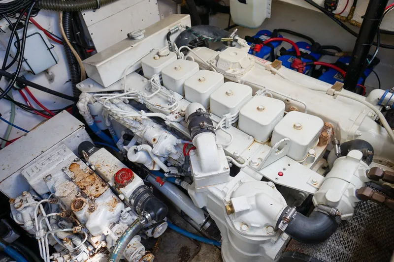 Slide: The Image of Engine room of a 1997 Tiara Yachts 3500 Express, showcasing mechanical components. - 54