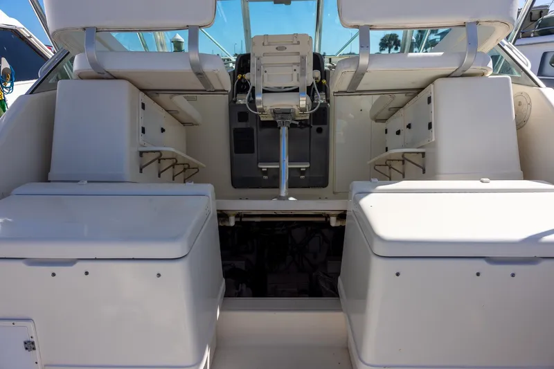 Slide: The Image of 1997 Tiara Yachts 3500 Express cockpit with seating and helm controls. - 14