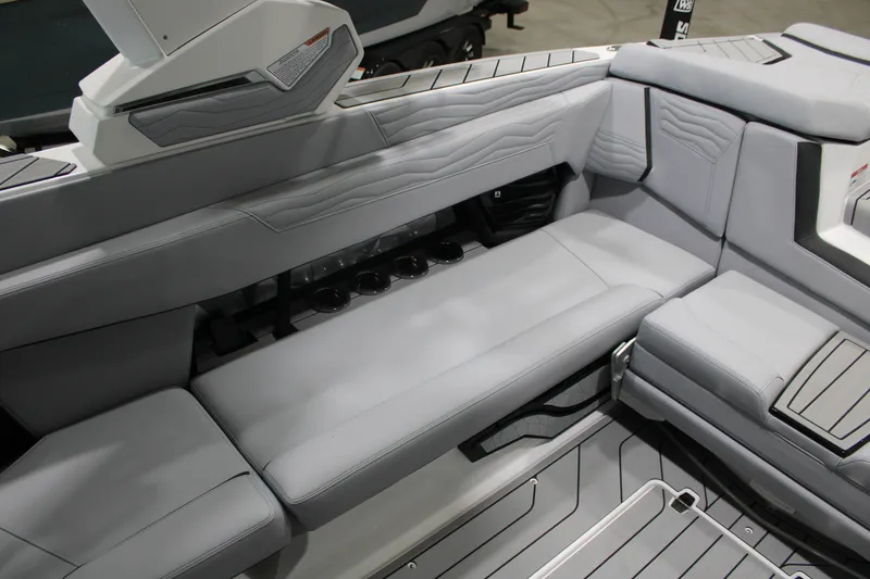 Slide: The Image of 2026 Nautique Super Air Nautique G25 interior with sleek gray seating and modern design. - 15