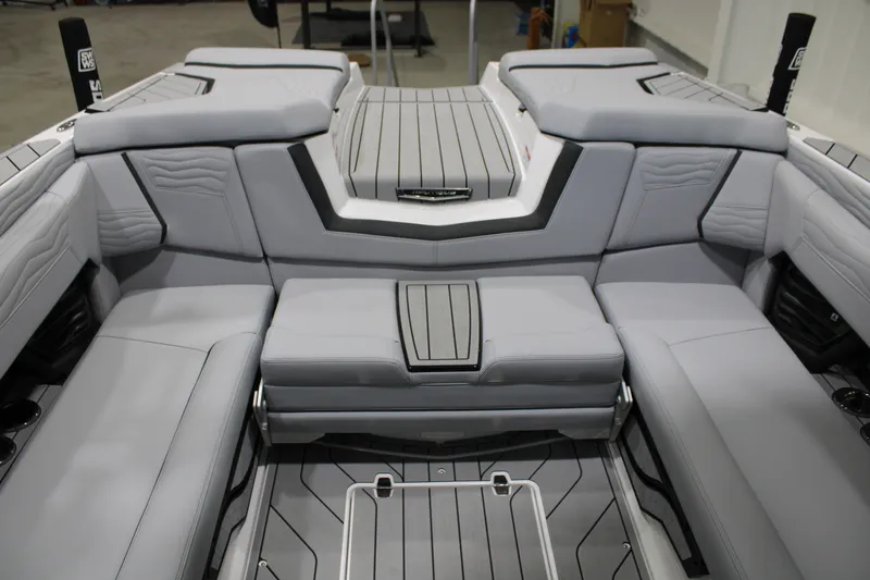 Slide: The Image of 2026 Nautique Super Air Nautique G25 interior with sleek gray seating and modern design. - 14