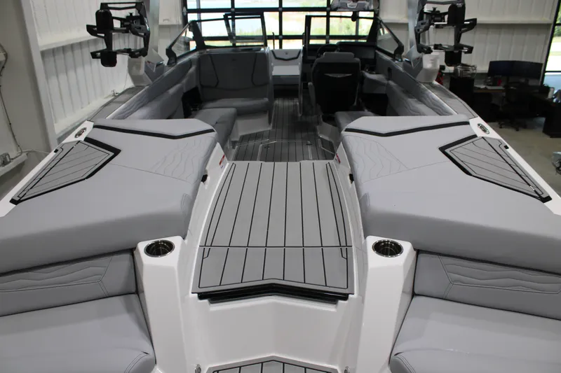 Slide: The Image of 2026 Nautique Super Air Nautique G25 interior with sleek gray seating and modern design. - 7