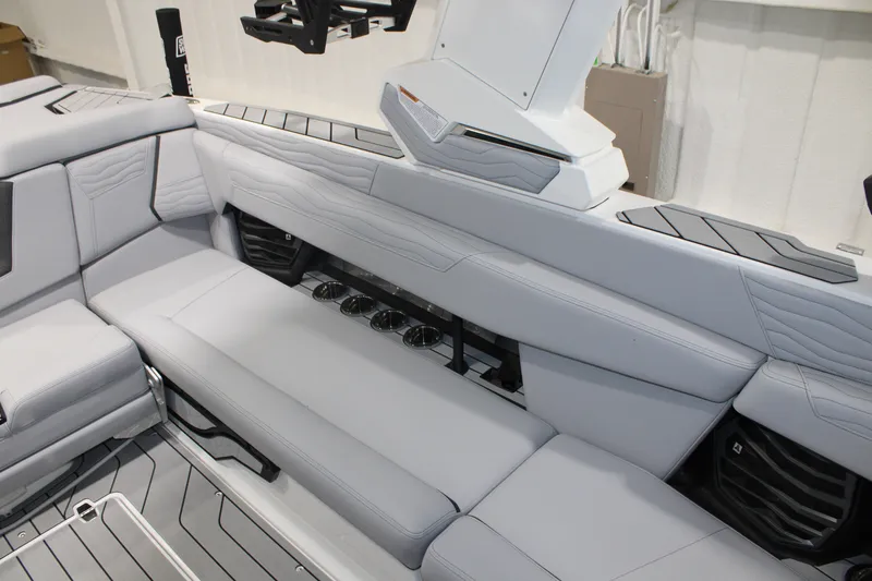 Slide: The Image of 2026 Nautique Super Air Nautique G25 interior with sleek gray seating and modern design. - 13