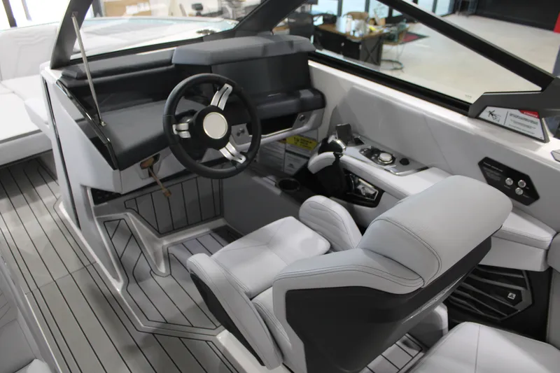 Slide: The Image of 2026 Nautique Super Air Nautique G25 cockpit with modern steering and controls. - 16