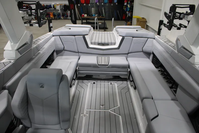 Slide: The Image of 2026 Nautique Super Air Nautique G25 interior with sleek gray seating and modern design. - 18