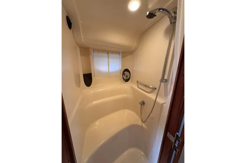 Slide: The Image of Shower area in 2006 Sea Ray 44 Sundancer yacht, featuring sleek design and modern fixtures. - 24