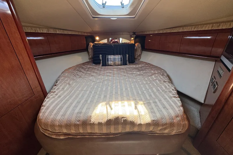 Slide: The Image of Luxurious cabin interior of 2006 Sea Ray 44 Sundancer yacht with cozy bedding. - 27