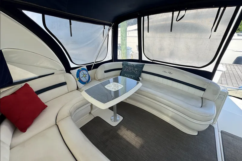 Slide: The Image of Luxurious 2006 Sea Ray 44 Sundancer yacht interior with plush seating and elegant table. - 8