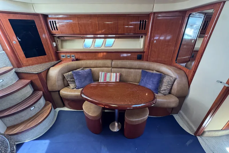 Slide: The Image of Luxurious 2006 Sea Ray 44 Sundancer interior with elegant seating and wooden finishes. - 21