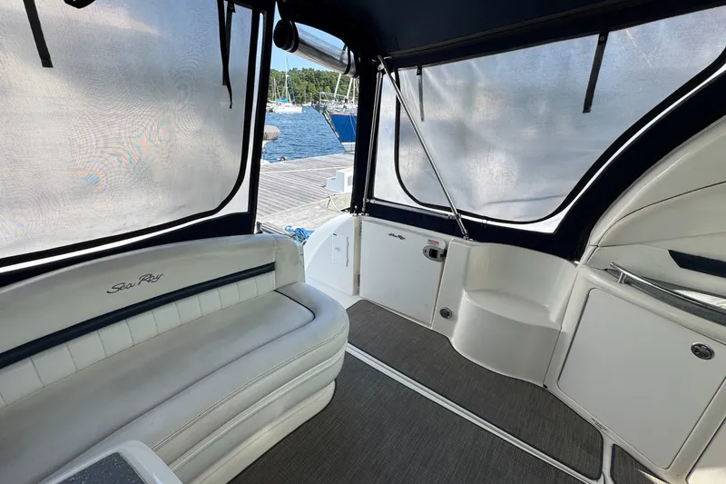 Slide: The Image of Interior view of 2006 Sea Ray 44 Sundancer yacht with seating and covered windows. - 7