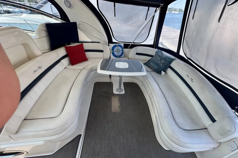 Slide: The Image of Luxurious interior of 2006 Sea Ray 44 Sundancer yacht with plush seating and table. - 9