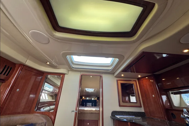 Slide: The Image of Interior of 2006 Sea Ray 44 Sundancer yacht with skylight and wooden cabinetry. - 17