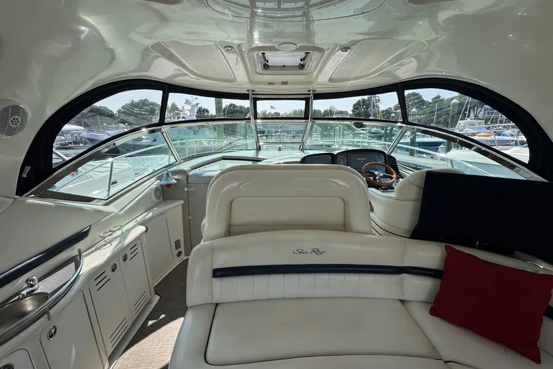 Slide: The Image of Luxurious interior of 2006 Sea Ray 44 Sundancer yacht with plush seating and panoramic windows. - 11