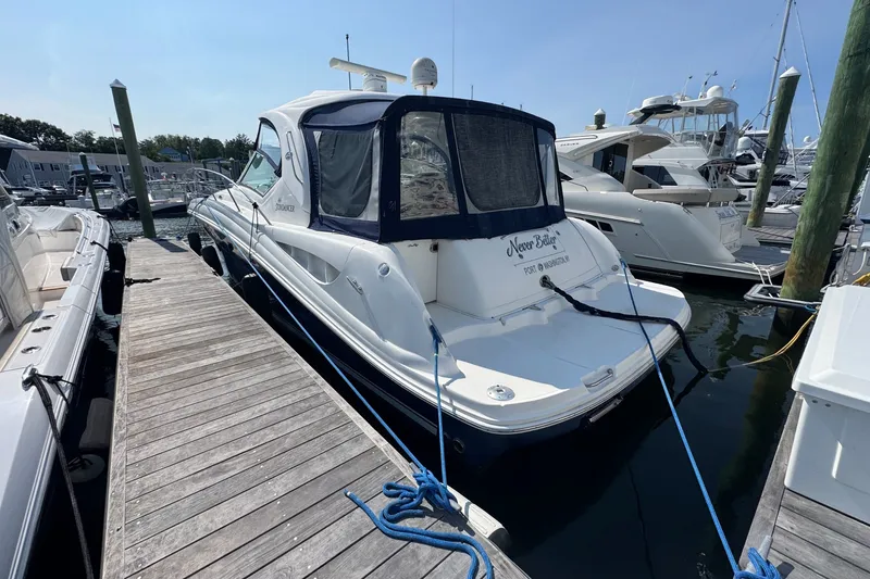 Slide: The Image of 2006 Sea Ray 44 Sundancer yacht docked at marina, rear view. - 5