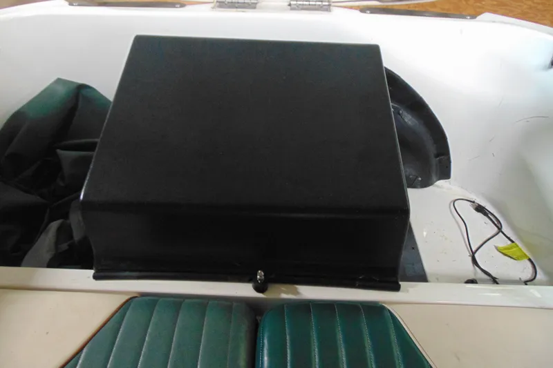 Slide: The Image of 2001 Sea-Doo Utopia 185 boat interior with black engine cover and green seating. - 12