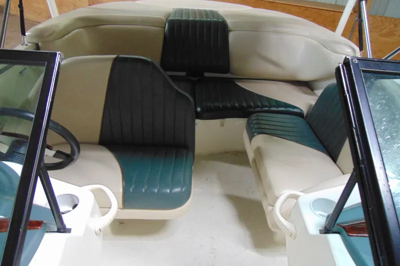 Slide: The Image of Interior of 2001 Sea-Doo Utopia 185 boat with green and beige seating. - 11