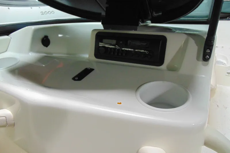 Slide: The Image of 2001 Sea-Doo Utopia 185 boat dashboard with stereo system and cup holder. - 9