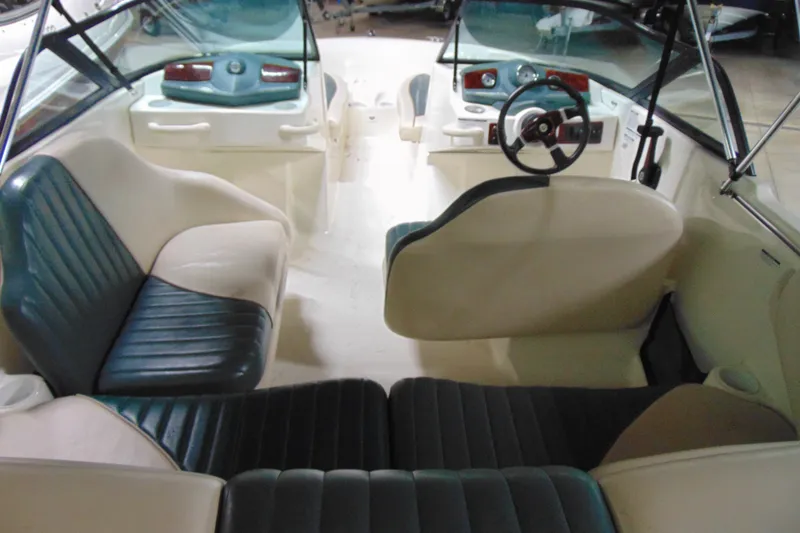 Slide: The Image of Interior of a 2001 Sea-Doo Utopia 185 boat with seating and steering wheel. - 6