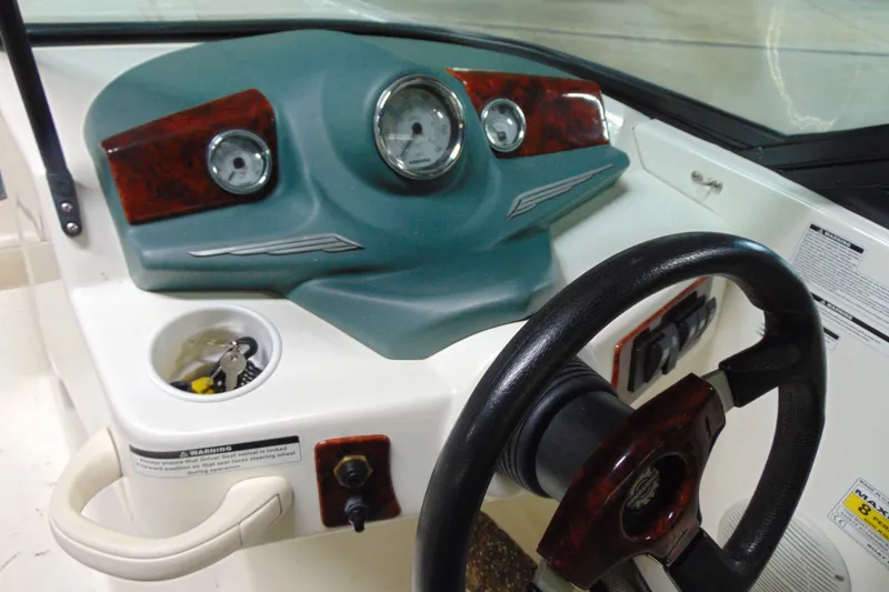 Slide: The Image of 2001 Sea-Doo Utopia 185 dashboard with steering wheel and instrument panel. - 7