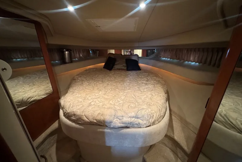 Slide: The Image of Luxurious cabin interior of 2003 Sea Ray 410 Sundancer yacht with elegant bedding. - 40
