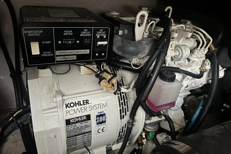 Slide: The Image of Kohler power system in a 2003 Sea Ray 410 Sundancer engine room. - 60