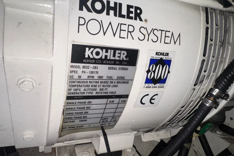 Slide: The Image of Kohler power system on 2003 Sea Ray 410 Sundancer, model 8EOZ-CB3, diesel generator. - 61