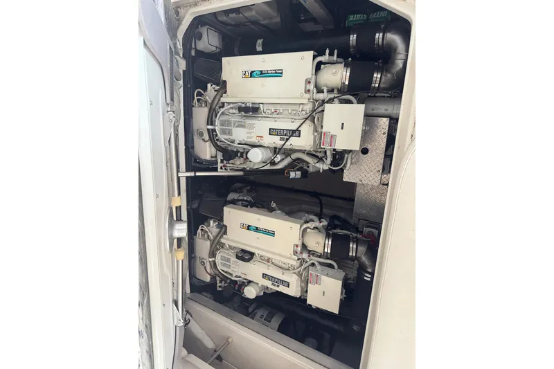 Slide: The Image of Engine compartment of a 2003 Sea Ray 410 Sundancer with dual Caterpillar engines. - 59