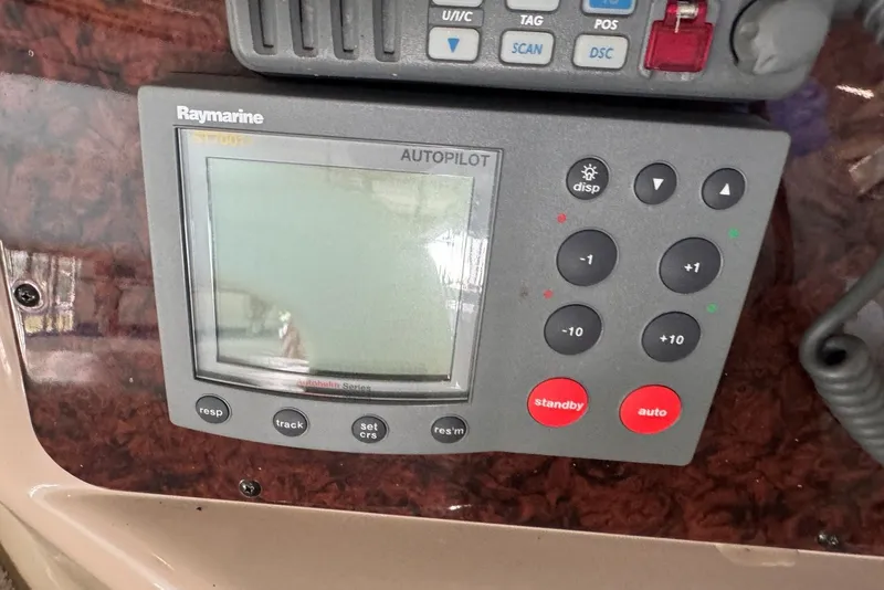 Slide: The Image of Raymarine autopilot system on 2003 Sea Ray 410 Sundancer boat dashboard. - 30