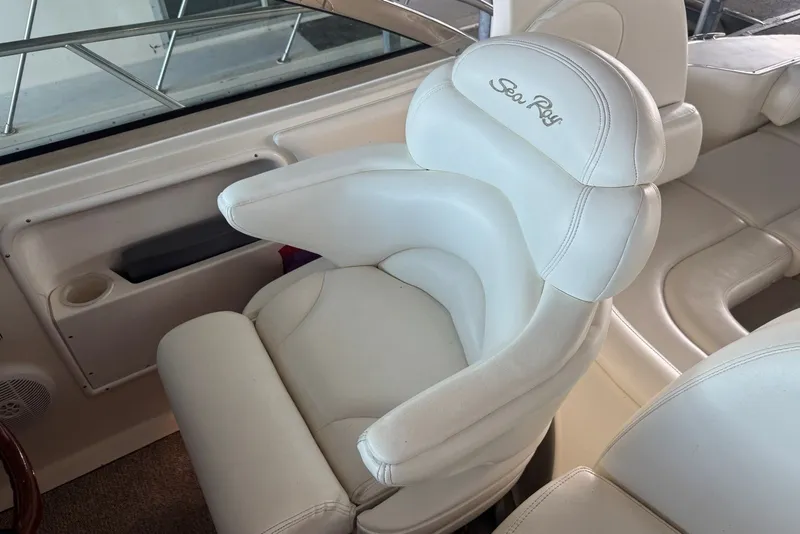 Slide: The Image of White leather captain's chair on 2003 Sea Ray 410 Sundancer yacht. - 25
