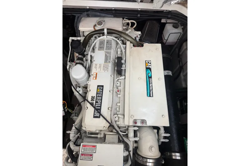 Slide: The Image of Engine of a 2003 Sea Ray 410 Sundancer boat, featuring a Caterpillar 350 engine. - 58