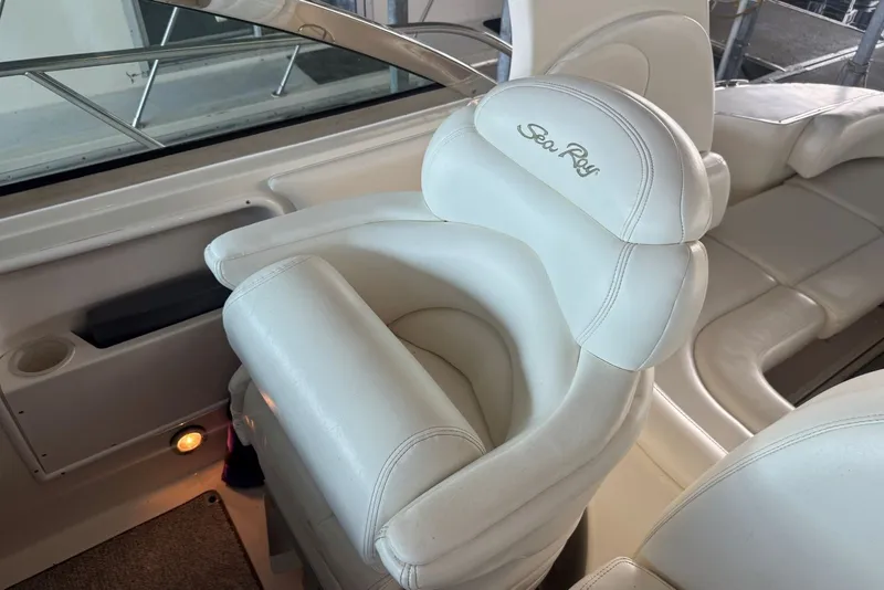 Slide: The Image of Luxurious white seating on a 2003 Sea Ray 410 Sundancer yacht. - 26