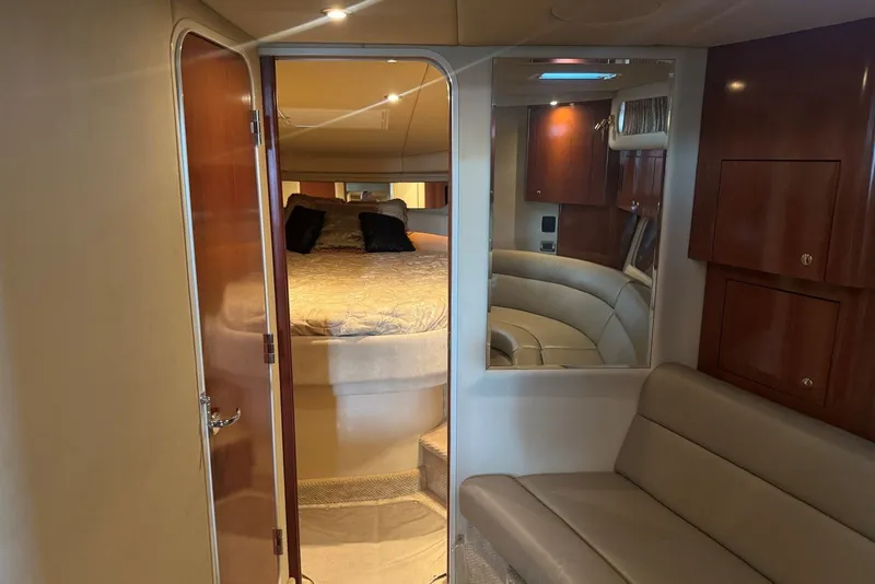 Slide: The Image of Luxurious interior of 2003 Sea Ray 410 Sundancer yacht with cozy bedroom and seating area. - 39