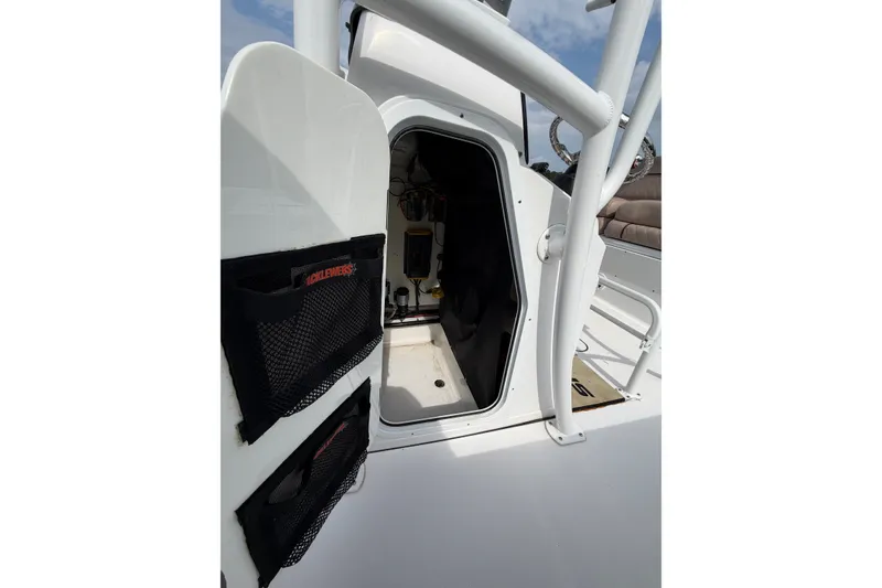 Slide: The Image of 2019 Sportsman Masters 227 Bay Boat interior storage compartment with tackle storage. - 14