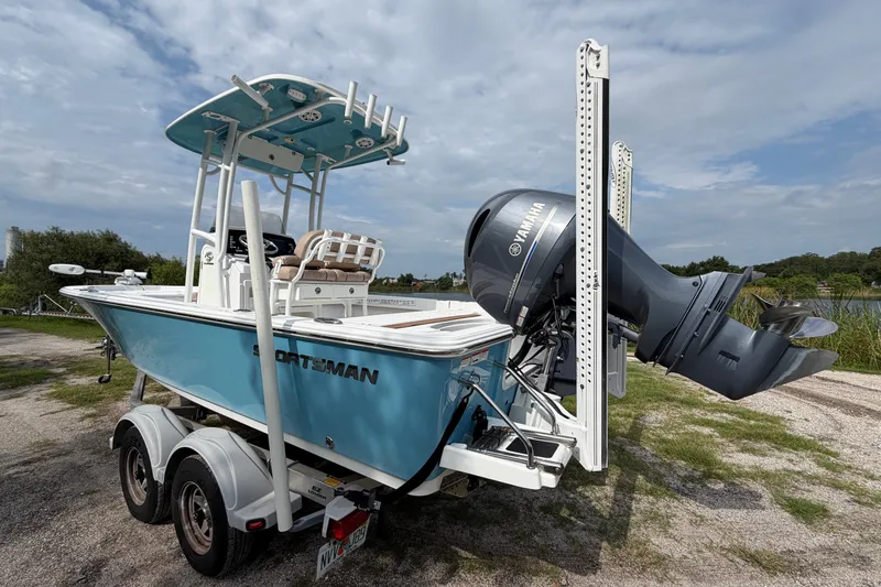 Slide: The Image of 2019 Sportsman Masters 227 Bay Boat with Yamaha engine on trailer, parked outdoors. - 3