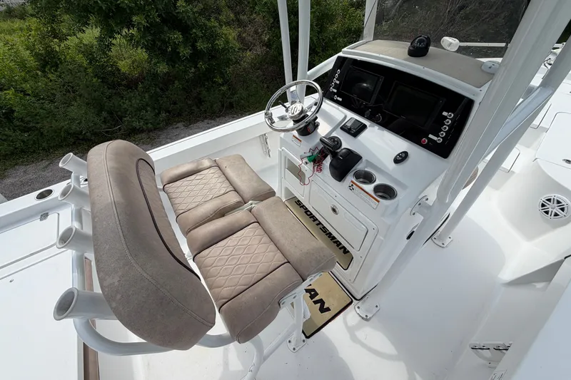 Slide: The Image of 2019 Sportsman Masters 227 Bay Boat cockpit with dual seats and modern control panel. - 11