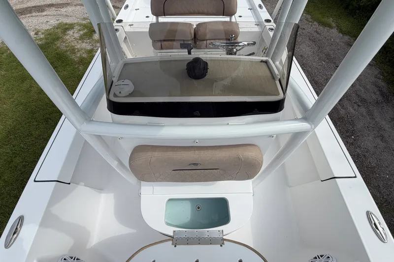 Slide: The Image of 2019 Sportsman Masters 227 Bay Boat interior with seating and console view. - 7