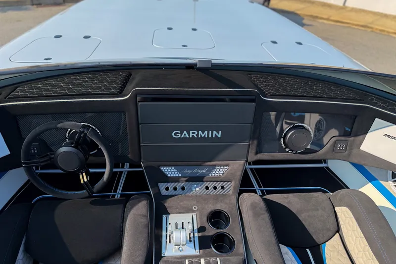 Slide: The Image of Interior of a 2026 Doug Wright 36 boat featuring Garmin navigation system. - 6