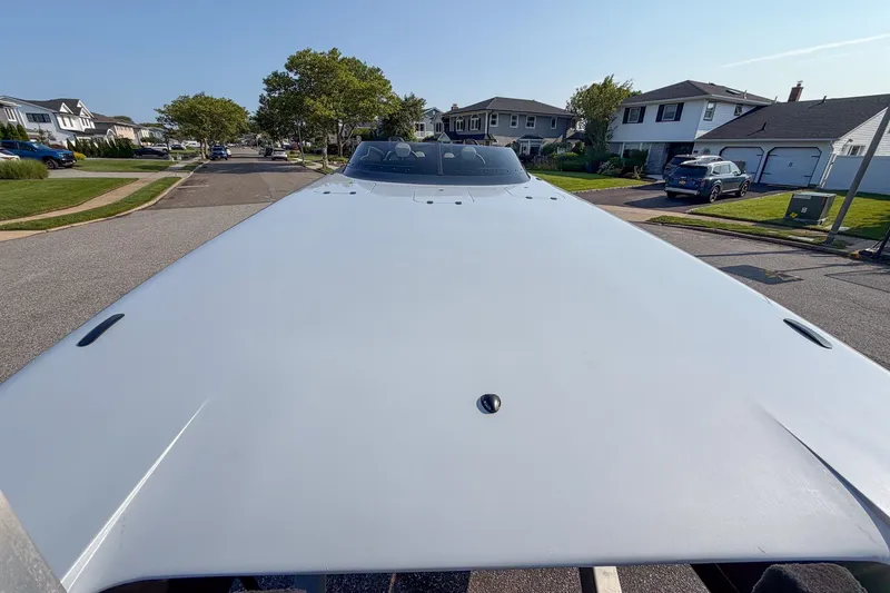Slide: The Image of 2026 Doug Wright 36 boat on suburban street, showcasing sleek design and modern architecture. - 3
