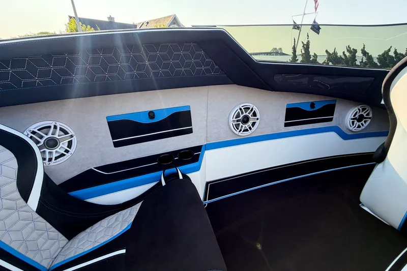 Slide: The Image of Interior of a 2026 Doug Wright 36 boat with modern seating and audio system. - 7
