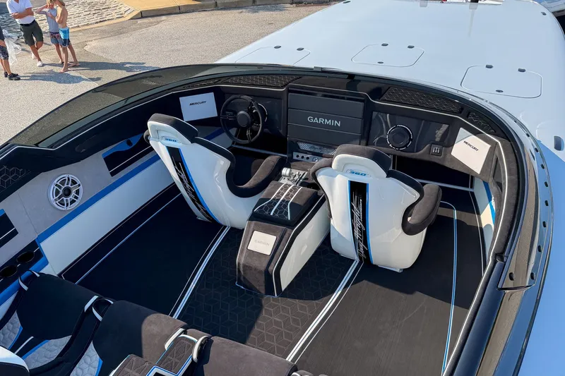 Slide: The Image of Interior of a 2026 Doug Wright 36 boat with modern navigation system and sleek seating. - 5