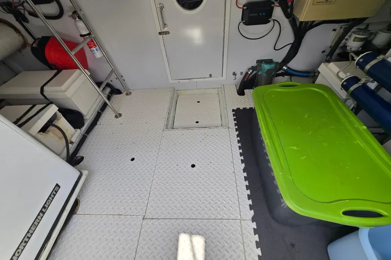Slide: The Image of Engine room of a 2004 Grand Harbour 58 yacht with equipment and storage. - 103