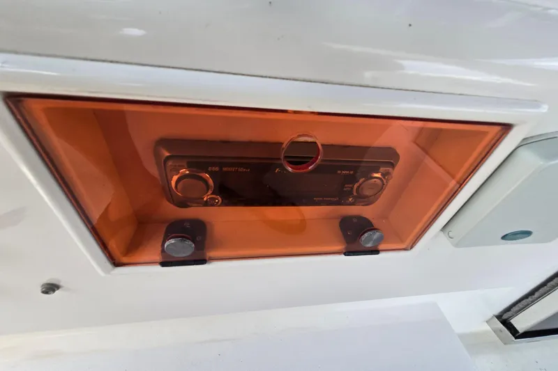 Slide: The Image of Stereo system in a 2004 Grand Harbour 58 boat, enclosed in an orange protective case. - 95
