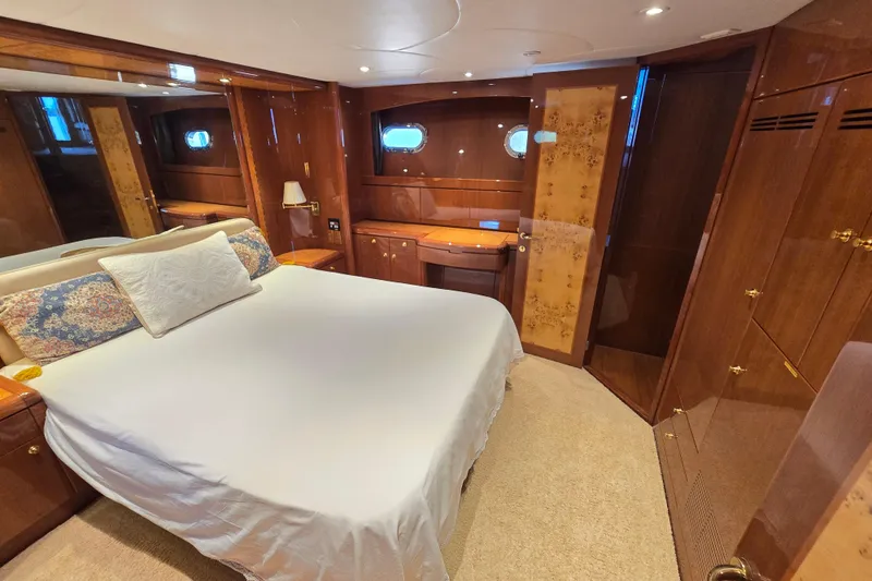 Slide: The Image of Luxurious bedroom interior of 2004 Grand Harbour 58 yacht with elegant wood finishes. - 44