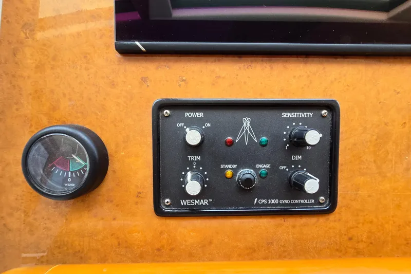Slide: The Image of Control panel of a 2004 Grand Harbour 58 boat with Wesmar CPS 1000 gyro controller. - 26