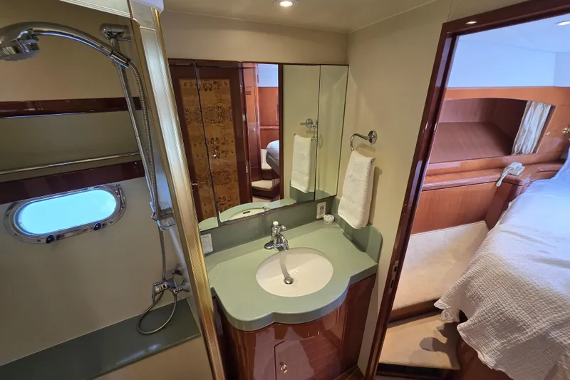 Slide: The Image of Luxurious bathroom interior of 2004 Grand Harbour 58 yacht, featuring modern fixtures and elegant design. - 74